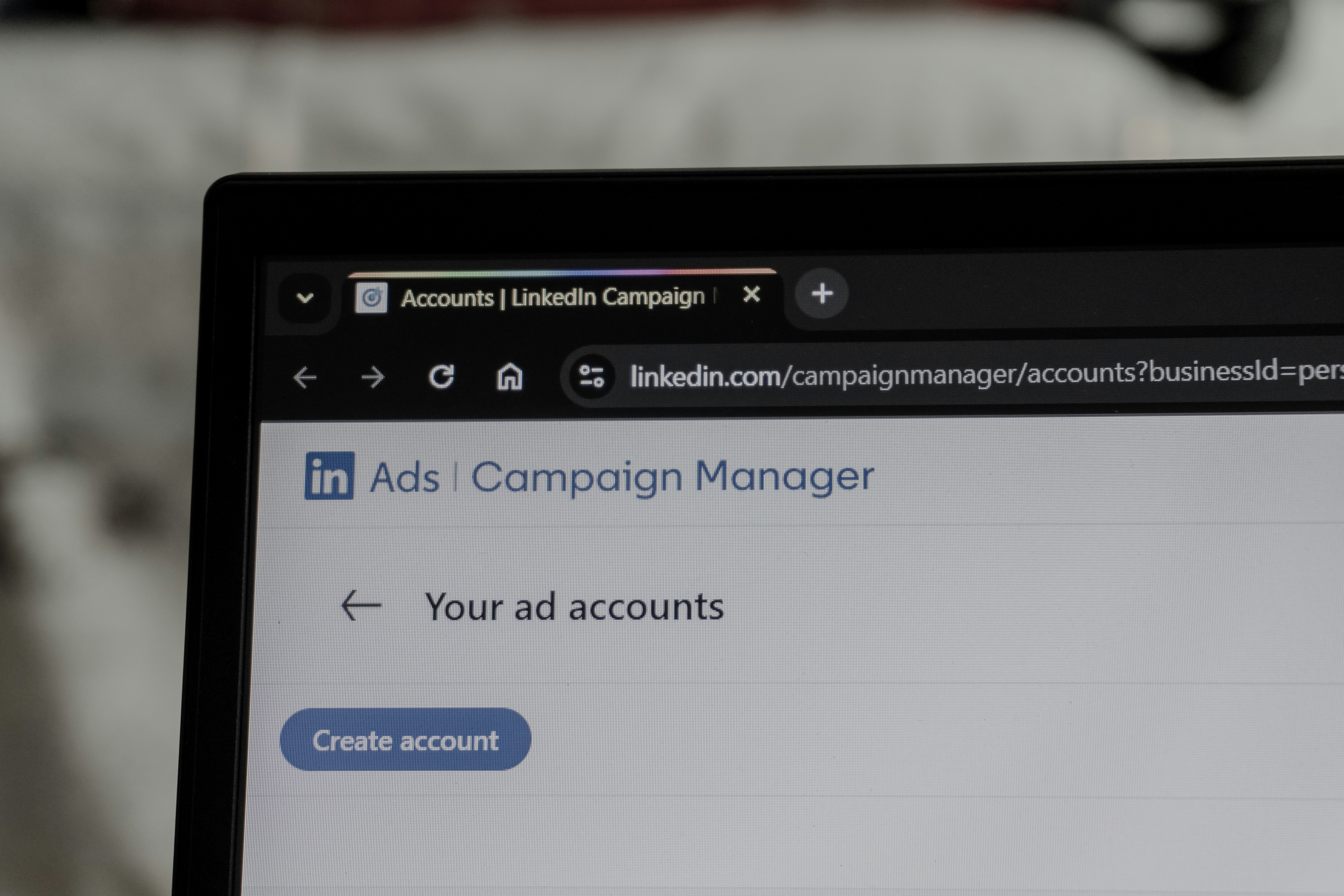 LinkedIn ads campaign manager interface on laptop screen